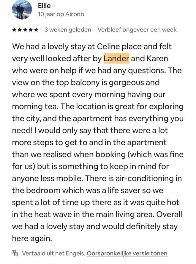 Five-star Airbnb review by Ellie, in English: felt very well looked after, a gorgeous view from the top balcony, more steps than expected, air-conditioning in the bedroom